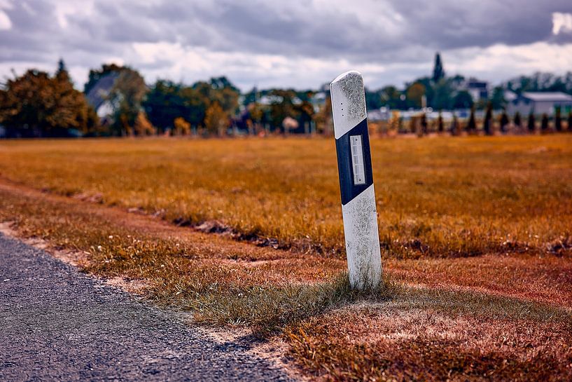 "Lonely road post in an autumnal landscape" by Momentaufnahme | Marius Ahlers