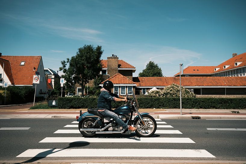 Biker on zebra crossing in Friesland by Inge Marije de Boer