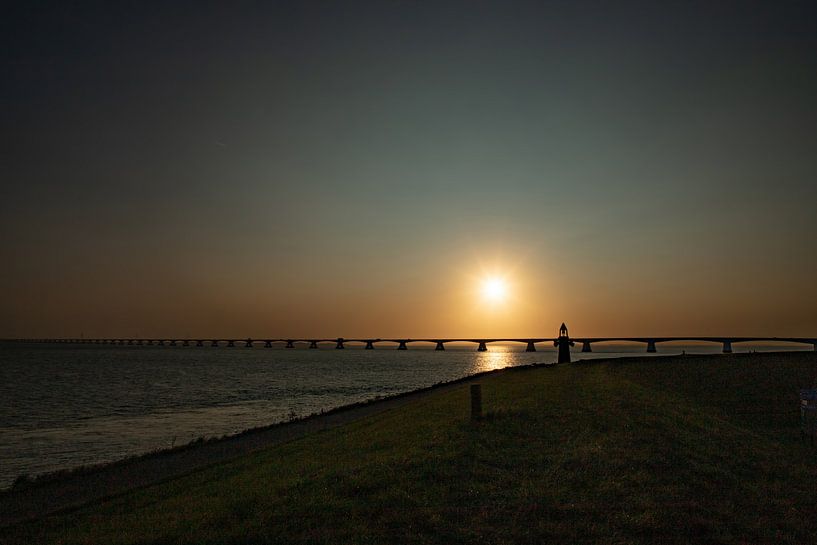 The Zeelandbrug with sunrise. by Gert Hilbink