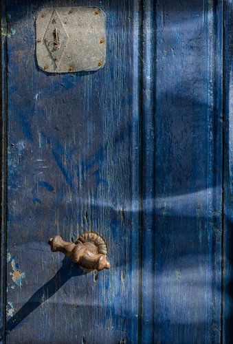 Old door in denim blue