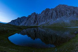 Reflection in the mountain lake by Denis Feiner