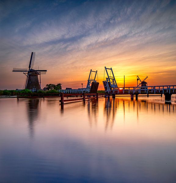 Windmill and drawbridge at sunset by Rene Siebring