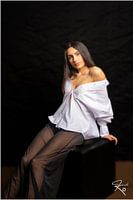 Seated girl with white shirt