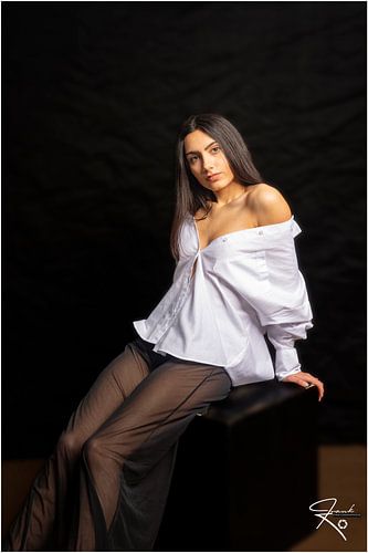 Seated girl with white shirt