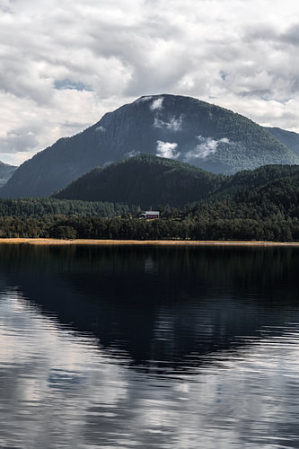 A profound silence hangs over the mirror-smooth waters of the Stangvikfjorden near Trollheimen