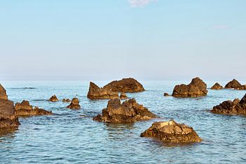 Volcanic rocks in the calm Mediterranean waters off Scalea