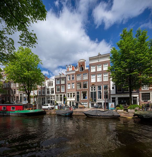Bridge and canal houses in Amsterdam by Joost Adriaanse