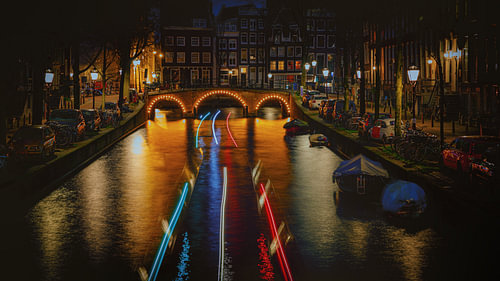 A canal boat passing along an Amsterdam canal
