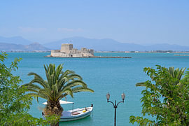 Bourtzi Fortress on an island in the blue sea, Nafplion, Greece by Tomherkules