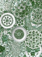 Collection of Delft blue plates from the Rijksmuseum Amsterdam. Here in green colourway