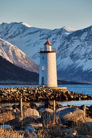 Høgstein lighthouse in the setting sun on Godøy, Norway by qtx