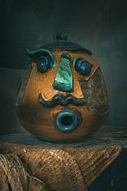 Bizarre ceramic face in a lost place - a work of art in decay by Infinite Decay