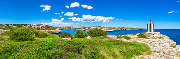 Beautiful coast view with lighthouse in Porto Cristo by Alex Winter