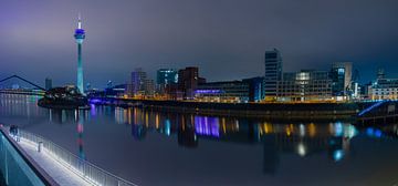 Panorama of the Düsseldorf skyline in the evening with the Rhine Tower. by Kim Willems