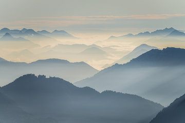 Silhouette of different mountains in the Ammergau Alps in the morning at sunrise. Hiking in the morn