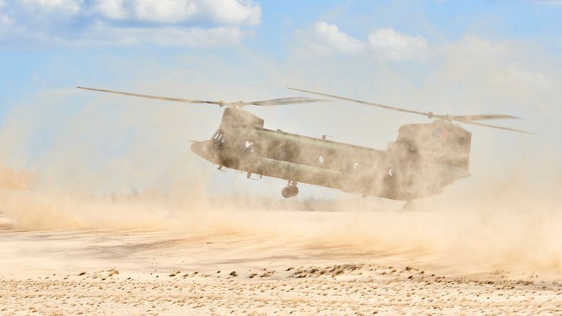 Chinook transport helicopter in a brown-out landing by Jenco van Zalk