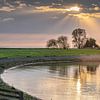 Coucher de soleil sur la petite baie de Molkwerum, sur la côte frisonne de l'IJsselmeer sur Harrie Muis