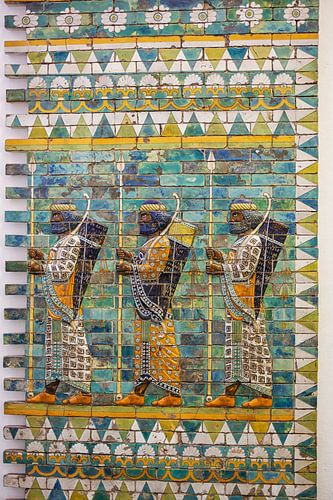 Three warriors on an ancient wall from Babylon