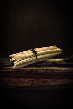 Still life with bundle of asparagus on antique table. Wout Kok One2expose by Wout Kok