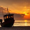 Fishing boat on the Baltic Sea beach at sunrise by Tilo Grellmann