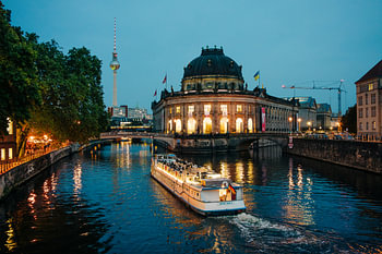 Berlin by night – a boat in front of the Bode Museum