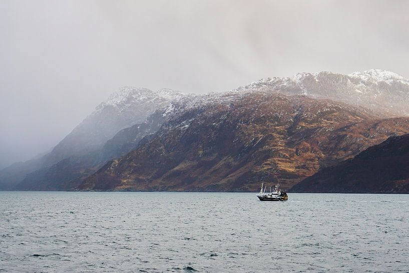 lonely boat at scottish glen with wild coast, rain showers and snow by Leo Schindzielorz