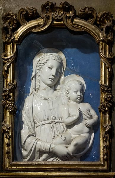 Ceramic tableau of Mary with child Jesus in church in Lucca, Italy by Joost Adriaanse