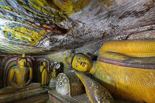 Buddha in the golden rock temple of Dambulla by Antwan Janssen