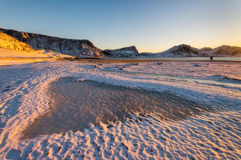 Heart shaped figure in the snow on the famous sand beach near Haukland during sunset on the Lofoten  by Robert Ruidl