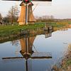 Oudkerker molen met weerspiegeling in de Nije Mear van Tim Groeneveld