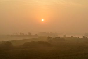 Sunrise over the river IJssel during a beautiful fall morning