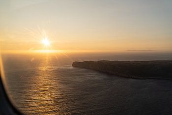 Zonsndergang vanuit vliegtuig