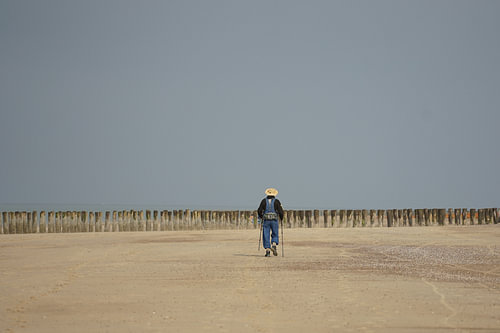 a man walking on the beach