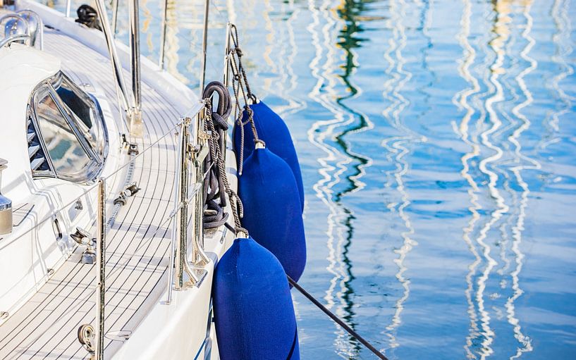 Close-up of modern sailboat with detail view of railing and boat deck by Alex Winter
