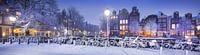 Winters Amsterdam panorama grachten avond sneeuw