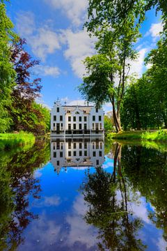 Staverden Castle reflected in pond on a sunny day by Rob Kints