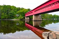 Red bridge over a river in Ontario, Canada