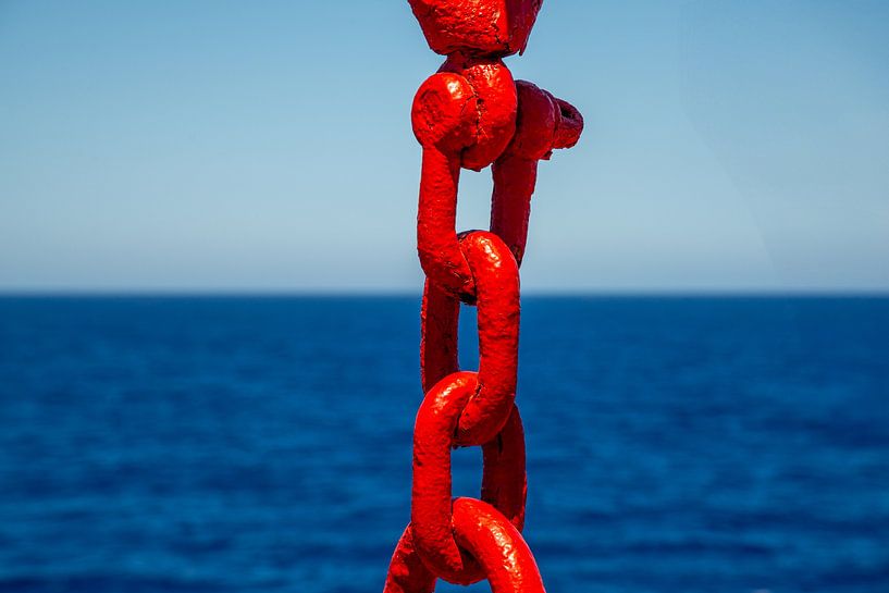 red painted metal chain on boat to Santorini, Greece by Jan Fritz