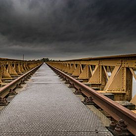 Old railway bridge during storm and thunderstorm by Erwin Floor