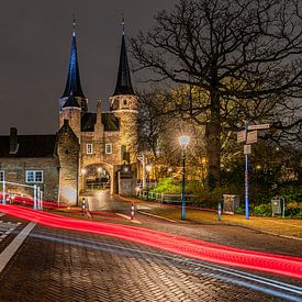 Driving past the Delft East Gate in the evening by Jeroen de Jongh