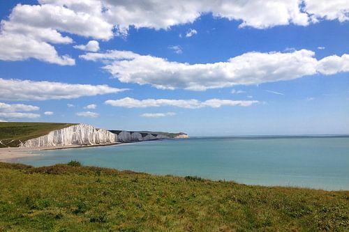 The whisper of the tides against the high cliffs