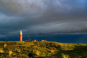 Texel lighthouse in the dunes during a stormy autumn night