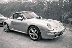 Porsche 911 sports car in the Alps in black and white