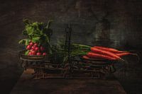 Vegetables on an antique scale still life