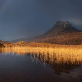 Stac Pollaidh with a rainbow in Scotland by Jos Pannekoek